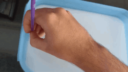 Von Kármán vortex street behind a drinking straw; milk was poured into the water to make the current visible