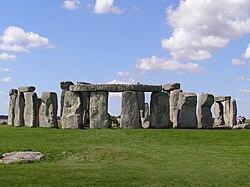Stonehenge in Wiltshire is a ring of stones, each about 4 m (13 ft) high, 2 m (7 ft) wide and 25 tonnes, erected 2400–2200 BC.