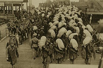 New Zealand troops unloading at a French port in 1918.