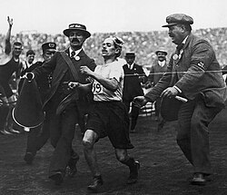 Dorando Pietri finishes the modern marathon in 1908 at the current distance.