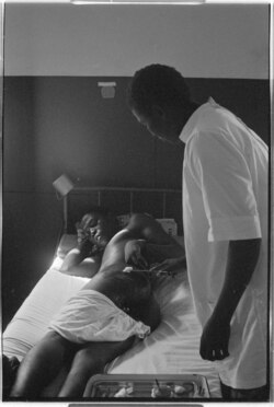A nurse treating a patient with burns, Ziguinchor PAIGC hospital, 1973