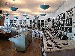 A pre-DCS/SCADA era central control room. Whilst the controls are centralised in one place, they are still discrete and not integrated into one system.