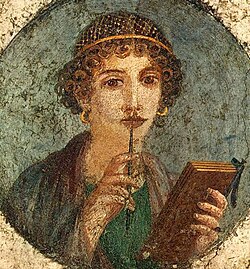 Woman holding wax tablets in the form of the codex. Wall painting from Pompeii, before 79 CE.