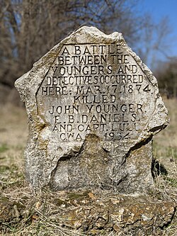 Civil Works Administration marker: "A battle between the Youngers and detectives occurred here. Mar.17.1874. Killed - John Younger, E.B. Daniels and Capt. Lull C.W.A. 1934"