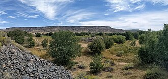 La Bajada Mesa from the valley of the Santa Fe River at La Bajada, New Mexico. The switchback route of the old El Camino Real de Tierra Adentro is visible at top center.