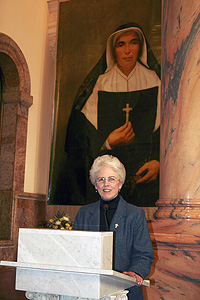 The former Superior General of the Sisters of Providence of Saint Mary-of-the-Woods, Sister Ann Margaret O'Hara, SP, in 2006. In the background a painting of the congregation's foundress, Mother Théodore Guérin.