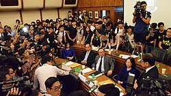 Students storm the conference room on 28 July after the HKU council votes again to delay Chan's appointment