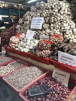 Garlic bulbs and cloves for sale at the Or Tor Kor market in Bangkok