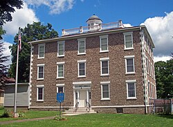 The Alexander Classical School three-story cobblestone building in Alexander, New York