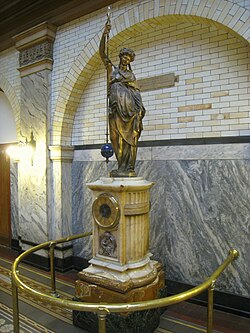Monumental conical pendulum clock by Eugène Farcot and sculpture by Albert-Ernest Carrier-Belleuse, which was donated to the university in 1912