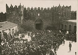The first large-scale anti-Zionist demonstrations in Palestine, March 1920, during the Occupied Enemy Territory Administration.[45] The crowd of Muslim and Christian Palestinians are shown outside Damascus Gate, Old City of Jerusalem.