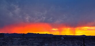 Precipitation in the form of a sunshower