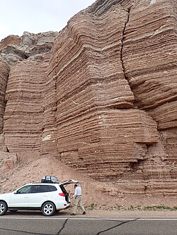 The Summerville Formation is composed of alternating thin beds of two lithologies, mudstone and sandstone, penetrated by veins of a third lithology, gypsum.