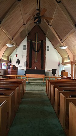 The chancel of this Lutheran church is adorned with black paraments on Good Friday, the liturgical colour associated with Good Friday in the Lutheran Churches.