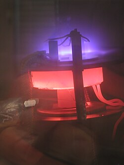 DC plasma (violet) enhances the growth of carbon nanotubes in a laboratory-scale PECVD (plasma-enhanced chemical vapor deposition) apparatus
