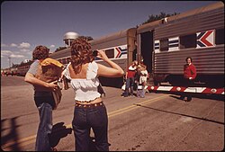 Passengers pose for a photo before boarding the Empire Builder in 1974. Amtrak trains traveling toward Chicago and Seattle stop daily between 1 and 4 am.[76] Photo by Charles O'Rear.