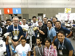 UNAM's robotics' team winning awards in the international Robocup competition.