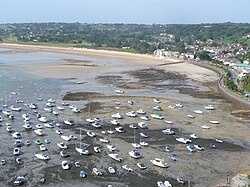 The harbour of Gorey, Jersey, falls dry at low tide.