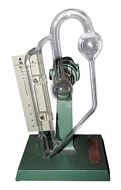 A glass McLeod gauge, drained of mercury