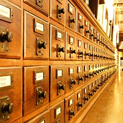 Until the advent of digital catalogues, card catalogues were the traditional method of organizing the list of resources and their location within a large library.