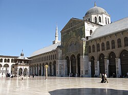 The Umayyad Mosque in Damascus built by Caliph Al-Walid I followed the plan of the Prophet's Mosque in Medina, and became the earliest example of a congregational mosque that served as standard for future mosques[67]