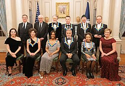 The 2022 honorees Amy Grant, Gladys Knight, U2, George Clooney, and Tania León with Secretary of State Antony Blinken at rear far left