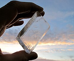 Calcite is the most stable polymorph of calcium carbonate. It is transparent to opaque. A transparent variety called Iceland spar (shown here) was used to create polarized light in the 19th century.[30]