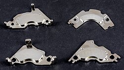 Neodymium magnets on mu-metal brackets from hard drives