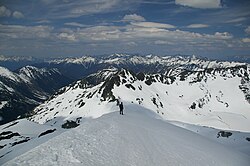 In steep avalanche-prone terrain, traveling on ridges is generally safer than traversing the slopes.