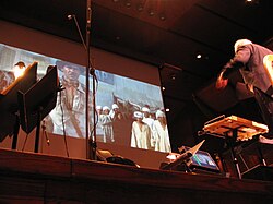 John Williams conducting the score to Raiders of the Lost Ark in the Avery Fisher Hall in 2007