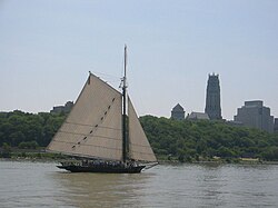 Clearwater sailing south on the Hudson River past Manhattan's Grant's Tomb and Riverside Church