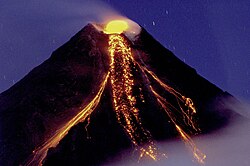Mayon Volcano in Philippines extruding lava flows during its eruption on 29 December 2009