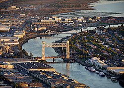 Fruitvale Bridge, spanning the Oakland Estuary, connects Alameda in the south to Oakland in the north.