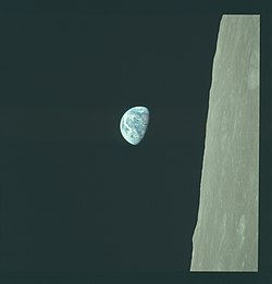 AS08-14-2383 (21713574299), from which Earthrise was cropped. The photo is displayed here in its original orientation as seen by the crew of Apollo 8. Lunar north is up.[13]