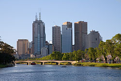 The Yarra River as it flows north-west towards central Melbourne, passing underneath the Swan Street Bridge