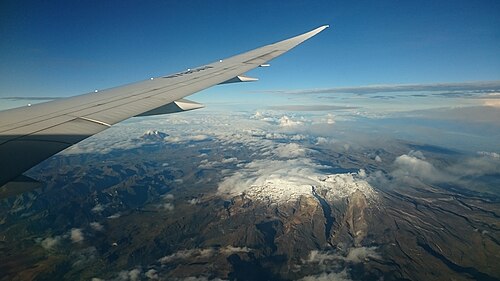 Photo of Nevado del Ruiz taken on approach to El Dorado International Airport, Bogotá. Nevado del Tolima is visible in the background on the left. Approximate altitude of photo: 7,180 m (23,550 ft).