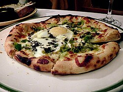 Pizza topped with egg from the Chez Panisse cafe