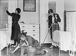 Girl guides cleaning a room, 1917
