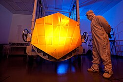 A mirror segment for the James Webb Space Telescope coated in gold to reflect infrared light