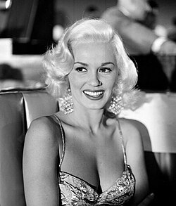 Mamie Van Doren plays Peggy DeFore, Jim Gannon's night club singer girlfriend who does a burlesque rendition of "The Girl Who Invented Rock and Roll".
