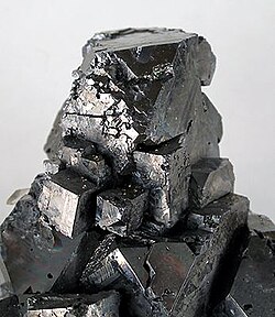 Galena, PbS, is a mineral with a high specific gravity.