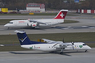 A Dash 8 in front of a BAe 146