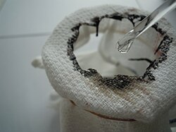 Drops of concentrated sulfuric acid rapidly decompose a piece of cotton towel by dehydration.