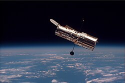 Hubble, as seen from Discovery during its second servicing mission