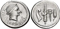 Denarius of Gaius Norbanus, 83 BC. The obverse depicts Venus, while the reverse features a prow-stem, fasces, caduceus, and an ear of wheat, an allusion to his father raising the siege of Rhegium during the Social War.[1]