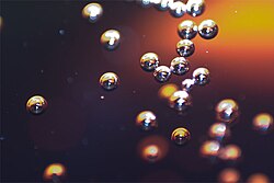 Bubbles of gas rising in a soft drink