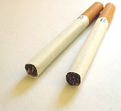 Two unlit, filtered German cigarettes