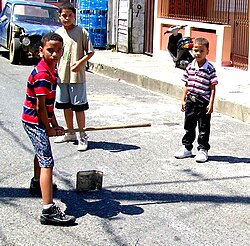 Plaquita, a Dominican street version of cricket. The Dominican Republic was first introduced to cricket through mid-18th century British contact,[92] but switched to baseball after the 1916 American occupation.[93]