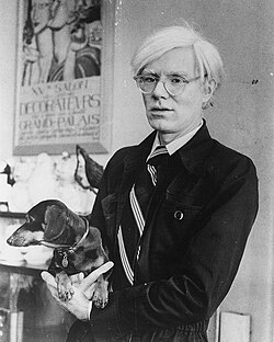 Warhol and his dachshund Archie at the Factory, 1974