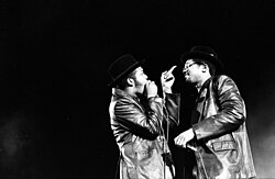 Simmons (left) and McDaniels (right) performing in 1984 in Long Beach, California.